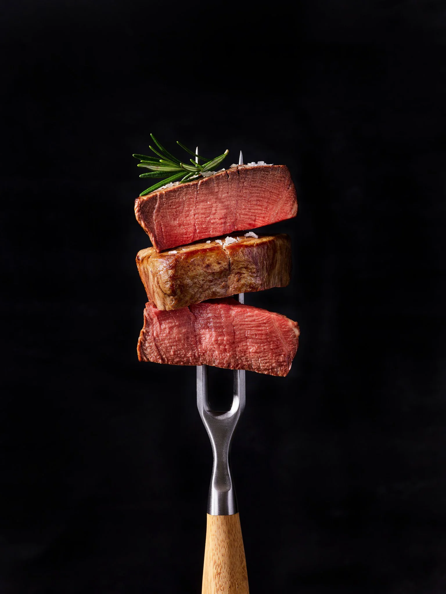 Allen Brothers USDA prime dry-aged steak sliced for a group dinner at Catch & Cut on Las Olas — best restaurant for groups in Fort Lauderdale (catchandcut.com)